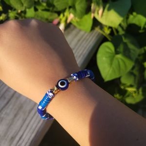 A Blue & Gold Evil Eye Clay Bead Bracelet